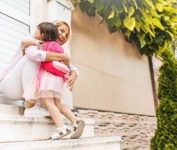 mommy hugs toddler from school